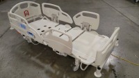 HILL-ROM CAREASSIST HOSPITAL BED W/SCALE,HEAD & FOOTBOARDS located at 902 nicholson road suite 200 Garland, TX 75042