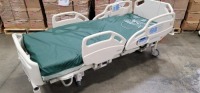 HILL-ROM CAREASSIST HOSPITAL BED W/SCALE,HEAD & FOOTBOARDS located at 902 nicholson road suite 200 Garland, TX 75042