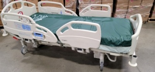 HILL-ROM CAREASSIST HOSPITAL BED W/SCALE,HEAD & FOOTBOARDS located at 902 nicholson road suite 200 Garland, TX 75042