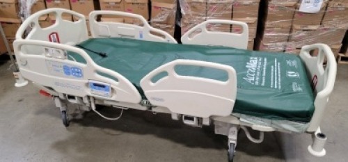 HILL-ROM CAREASSIST HOSPITAL BED W/SCALE,HEAD & FOOTBOARDS located at 902 nicholson road suite 200 Garland, TX 75042