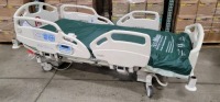 HILL-ROM CAREASSIST HOSPITAL BED W/SCALE,HEAD & FOOTBOARDS located at 902 nicholson road suite 200 Garland, TX 75042