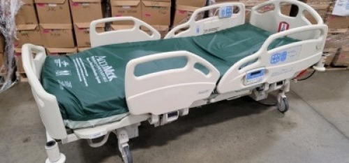 HILL-ROM CAREASSIST HOSPITAL BED W/SCALE,HEAD & FOOTBOARDS located at 902 nicholson road suite 200 Garland, TX 75042