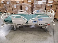 HILL-ROM CAREASSIST HOSPITAL BED W/SCALE,HEAD & FOOTBOARDS located at 902 nicholson road suite 200 Garland, TX 75042