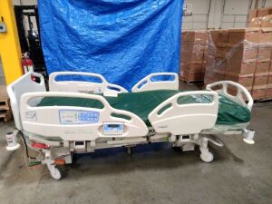 HILL-ROM CAREASSIST ES HOSPITAL BED W/SCALE,HEAD & FOOTBOARDS located at 902 nicholson road suite 200 Garland, TX 75042