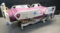 HILL-ROM P1900 TOTALCARE SPORT HOSPITAL BED WITH CPR AND FOOT BOARD AND 2 MODULES (PERC & VIB., ROTATION)