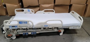 HILL-ROM VERSACARE HOSPITAL BED W/SCALE & FOOTBOARD