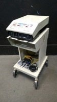 CONMED SABRE 2400 ESU WITH MONO AND BIPOLAR FOOT SWITCHES ON ROLLING CART