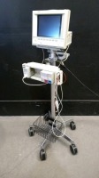 HP M1204AR CMS 24 OMNICARE PATIENT MONITOR WITH MODULE RACK, MODULES (ECG/RESP, SPO2/PLETH, NBP), AND ECG CABLE ON ROLLING STAND