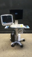 GE DASH 5000 PATIENT MONITOR ON COMPUTER CART