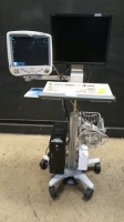 GE DASH 5000 PATIENT MONITOR ON COMPUTER CART