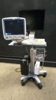 GE DASH 5000 PATIENT MONITOR ON COMPUTER CART