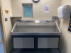 AMSCO DOUBLE BASIN, KNEE OPERATED SCRUB SINK (THIS LOT REQUIRES PROFESSIONAL DE-INSTALLATION AND CERTIFICATE OF INSURANCE)