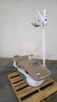 ROYAL ALLIANT POWER EXAM CHAIR WITH FOOT CONTROL AND PROMA DENTAL LIGHT