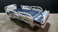 STRYKER SECURE 3002 S3 HOSPITAL BED WITH HEAD & FOOTBOARD (CHAPERONE WITH ZONE CONTROL, BED EXIT, SCALE) (IBED AWARENESS)