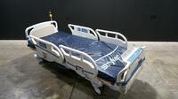 STRYKER SECURE 3002 S3 HOSPITAL BED WITH HEAD & FOOTBOARD (CHAPERONE WITH ZONE CONTROL, BED EXIT, SCALE) (IBED AWARENESS)