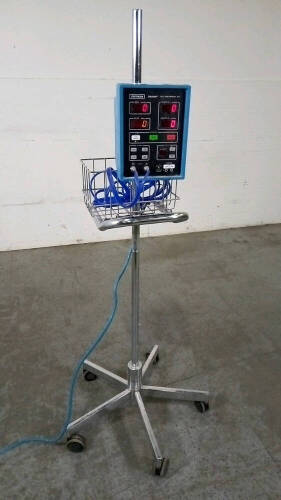 CRITIKON DINAMAP 8100 VITAL SIGNS MONITOR WITH BP CABLE ON ROLLING STAND