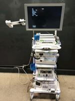 OLYMPUS ENDOSCOPY SYSTEM TO INCLUDE EVIS EXERA CV-180 VIDEO PROCESSOR WITH MAJ-1430 PIGTAIL, CLV-180 LIGHT SOURCE, PSD-20 ESU SYSTEM WITH FOOTSWITCH, OFP-2 ENDOSCOPIC FLUSHING PUMP, UCR INSUFFLATOR, OEP-4 PRINTER & SONY MONITOR ON CART